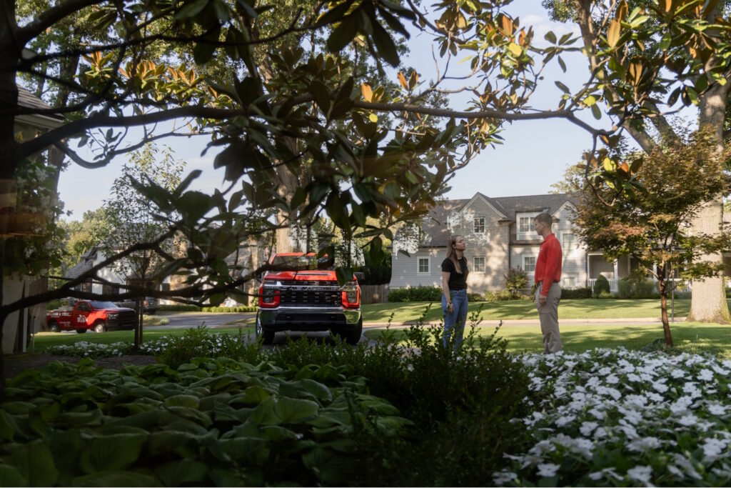 RYAN expert talking with home owner in front yard
